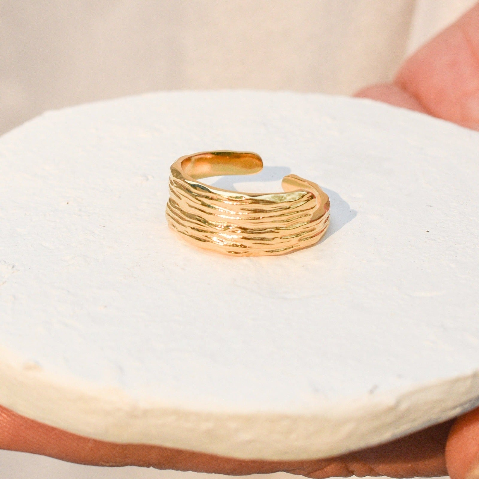 sunlit gold ring woman