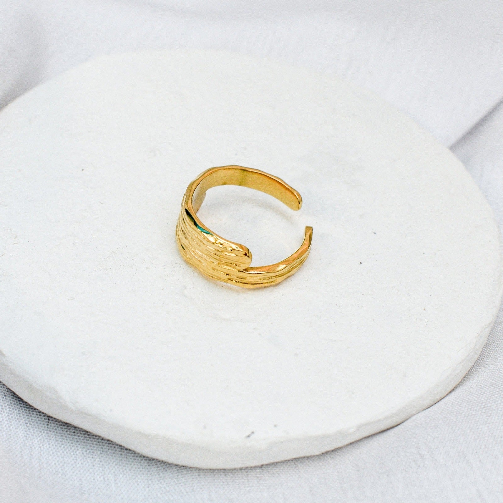 sunlit gold ring woman