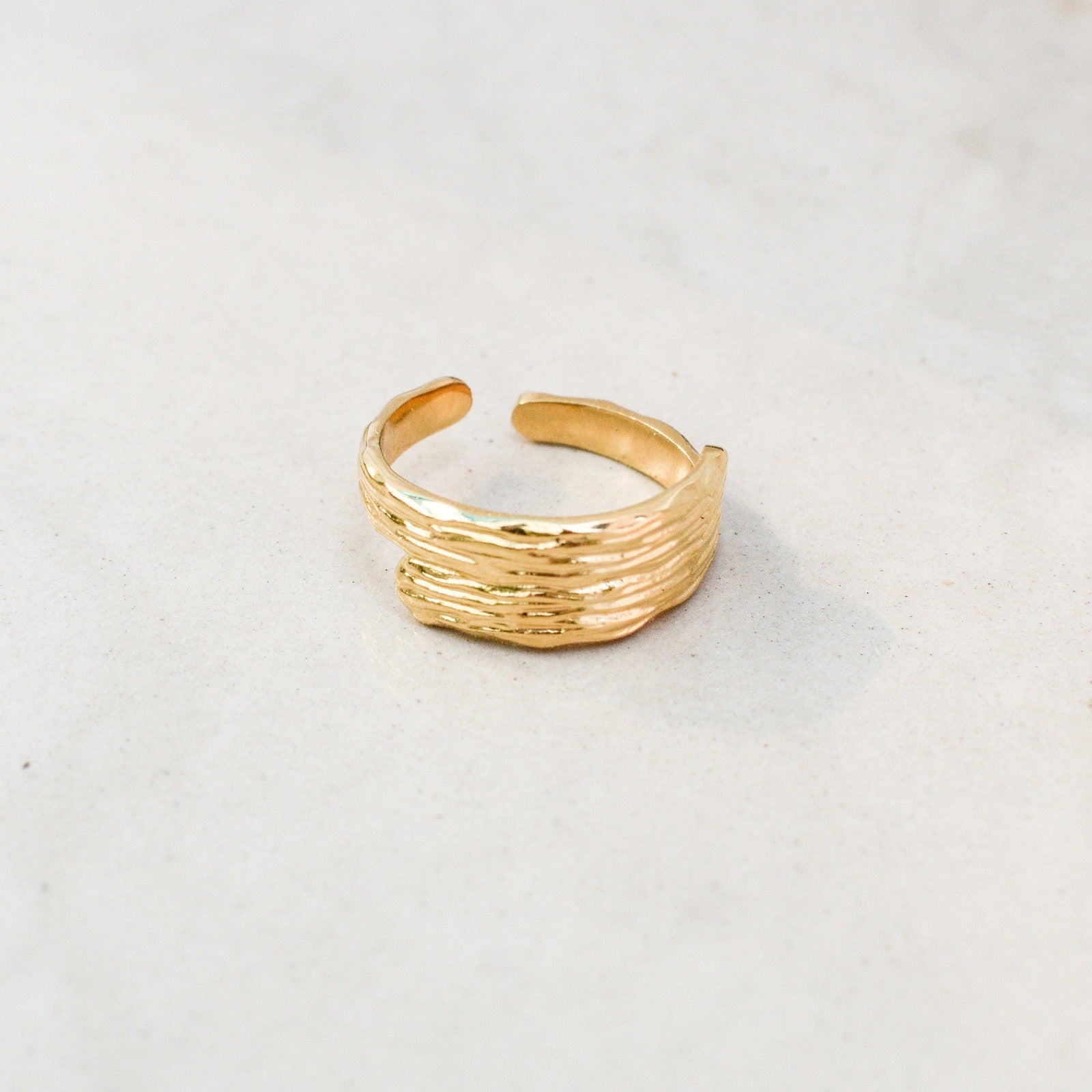 sunlit gold ring woman