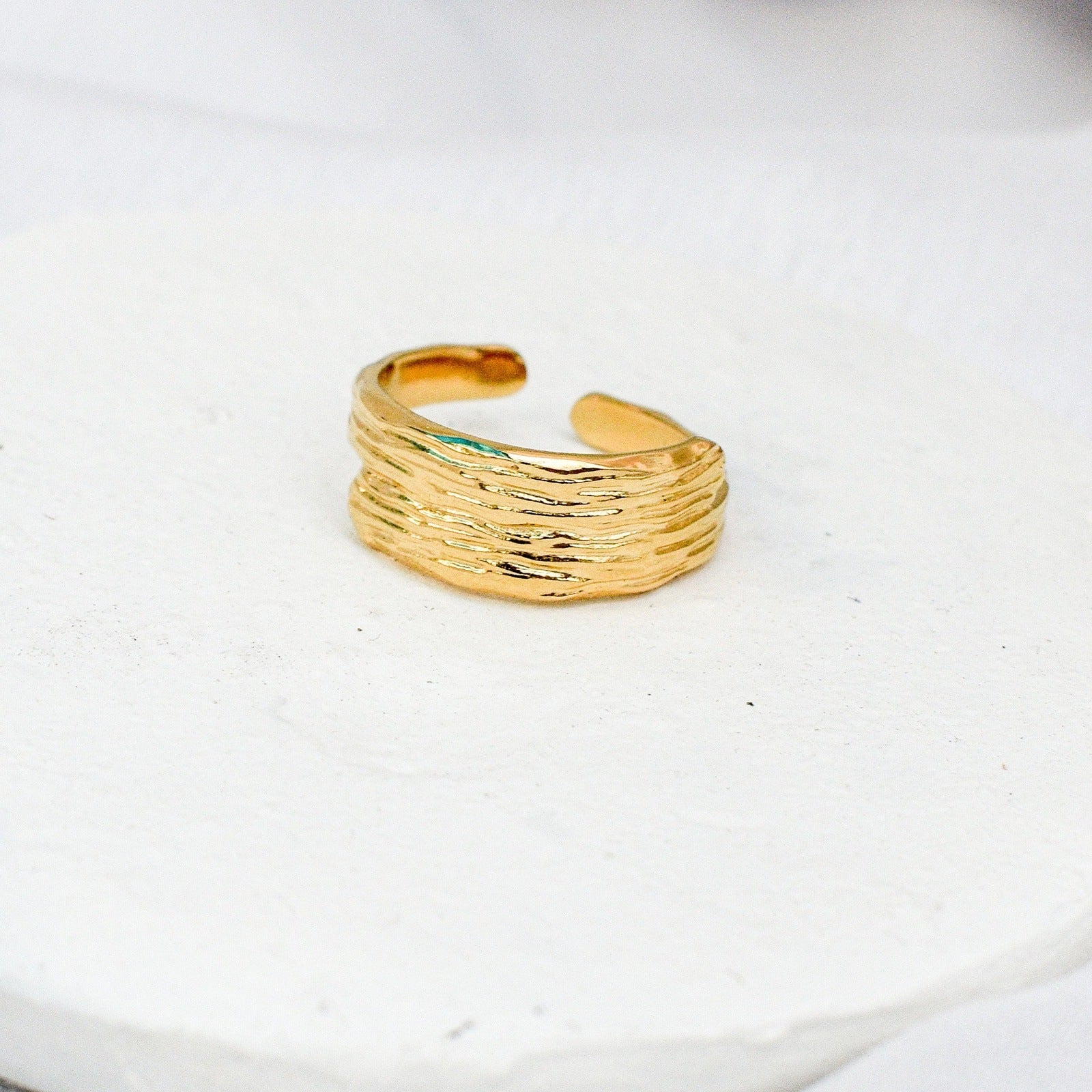 sunlit gold ring woman