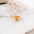 sunlit gold ring woman